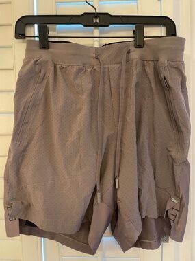 lululemon perforated shorts in mauve and black